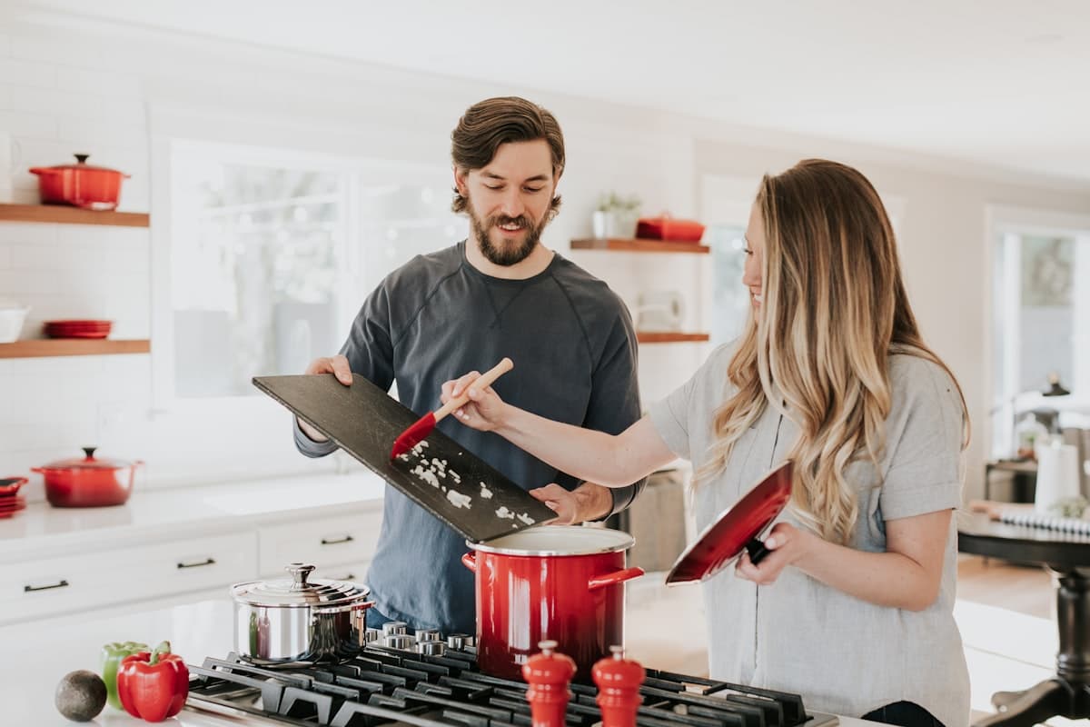 A couple together in their kitchen at home.